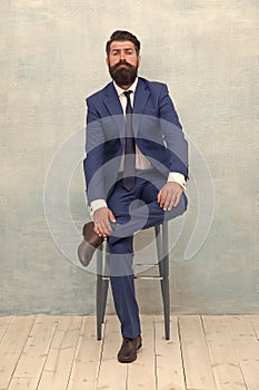 Sophisticated and classy. Confident businessman sit on chair. Fashion look of project manager. Formal fashion style