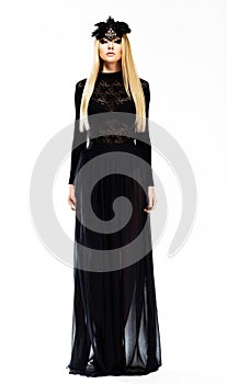 Sophisticated Elegant Blonde in Evening Black Dress and Headwear with Feathers. Art Design