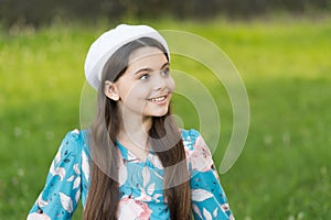 Sophisticated fashionista little girl wear beret hat and fancy dress nature background, summer outfit concept