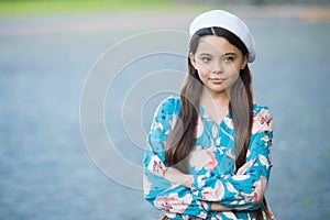 Sophisticated fashionista little girl wear beret hat and fancy dress, refined manners concept