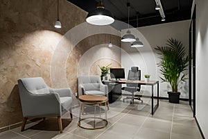 Sophisticated office with textured wall, chic seating, pendant lights, potted plant, and tiled floor