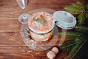 Sophisticated salad with champagne, parmesan and fork on a wooden background