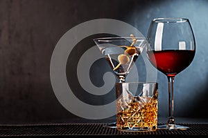 Sophisticated spirits trio: whiskey, wine, cocktail, elegant and enticing