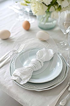 Sophisticated table setting with elegant dinnerware and a floral touch. AI Generated