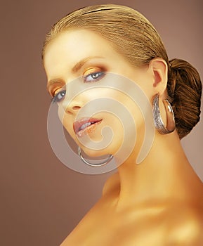 Sophistication. Portrait of Noble Aristocratic Lady with Earrings photo