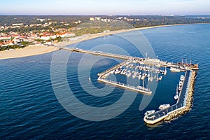 Sopot resort in Poland with pier, marina yachts and beach. Aeri