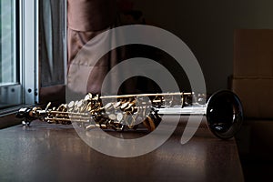Soprano Saxophone Mouthpiece, Closeup Woodwind Instrumental Equipment on Blur Saxophone Background photo