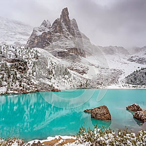 Sorapis lake in dolomiti mountains, italy. in winter photo