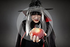 Sorcerer offering a poisoned apple photo