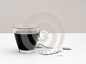 Sore head breakfast - black coffee and aspirin, painkillers. photo
