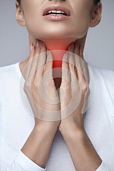 Sore Throat. Closeup Beautiful Woman Hands And Neck. Throat Pain