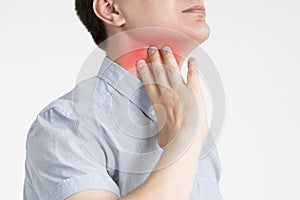 Sore throat, men with pain in neck, gray background