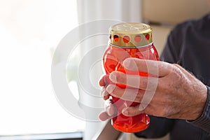 Sorrow man over loss his nearest relative; with the candle