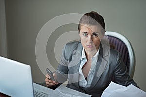 Sorrowful business woman working at desk