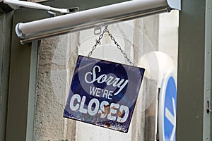 Sorry we are closed sign board on door shop restaurant cafe store