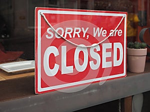 sorry closed sign in shop window