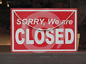 sorry closed sign in shop window