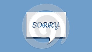 Sorry message on cutout paper speech bubble on blue background