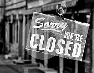 `Sorry we`re closed` sign on the cafe door