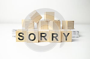 sorry word written on wood block. sorry text on table, concept