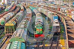 Sorting freight wagons locomotive on the railroad while formation the train.