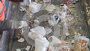 Sorting of garbage on the conveyor of the waste recycling plant, Russia