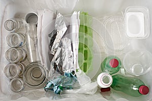 Sorting of garbage types. Waste management concept. Top view. Conceptual image for environmental pollution and consumerism