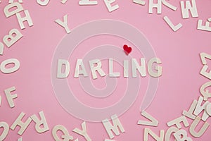 Sorting letters Darling on pink background