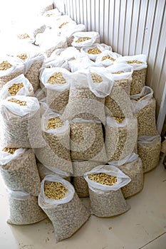 Sorting and packing line of stuffed breakfast cereal pillows at factory conveyor for cereal snack production of flour products -