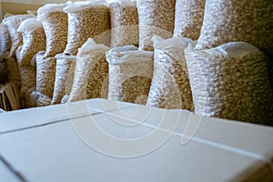 Sorting and packing line of stuffed breakfast cereal pillows at factory conveyor for cereal snack production of flour products -