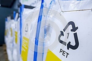 Sorting recyclables. The sorted polyethylene terephthalate PET plastic, is placed in a container with the appropriate marking