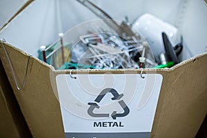 Sorting recyclables. The sorted scrap metal, is placed in a container with the appropriate marking