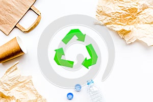 Sorting waste and recycle. Green paper recycling sign on white background top view space for text