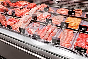 sorts of meat on display in shop or supermarket