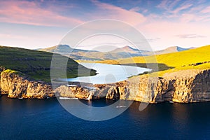 Sorvagsvatn lake on cliffs of Vagar island in sunset, Faroe Islands