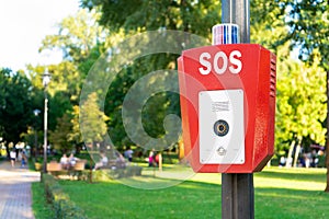 SOS, police, emergency button in the public park.