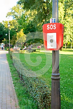 SOS, police, emergency button in the public park.