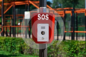 SOS, police, emergency button in the public park.