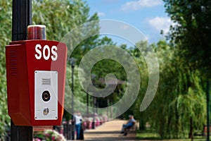 SOS, police, emergency button in the public park.