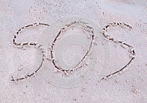 SOS Sign on the beach