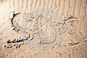 Sos sign write on sand