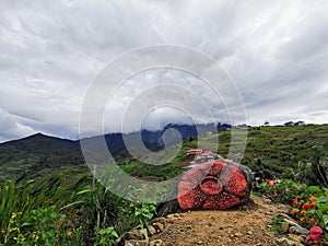 Sosodikon Hill green landscape at with a young man during cloudy day