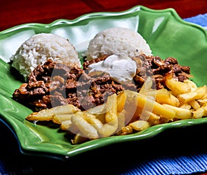 Sote stroganoff with rice and french fries