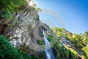 Sotillo waterfall in Sanabria with sunstar over the rocks