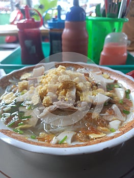 Soto Ayam Lamongan - Lamongan chicken soup with a yellowish sauce, Indonesian food