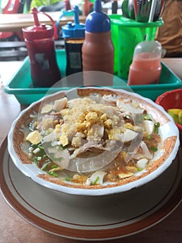 Soto Ayam Lamongan - Lamongan chicken soup with a yellowish sauce, Indonesian food