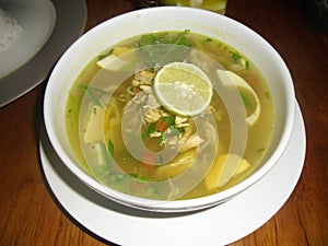 soto ayam is a soupy dish with lots of Indonesian spices photo