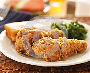 Soul food - fried chicken with collard greens photo