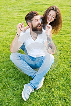 Soulmates closest people. Simple happiness. Couple in love relaxing on green lawn. Playful girlfriend and boyfriend