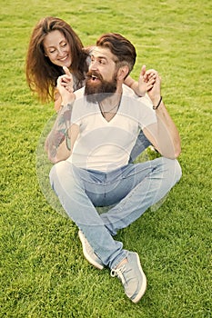 Soulmates closest people. Simple happiness. Couple in love relaxing on green lawn. Playful girlfriend and boyfriend